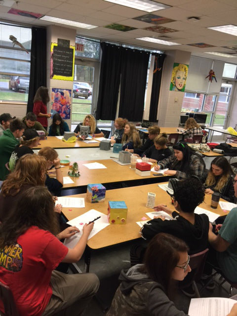 Ceramics students critiquing artwork 